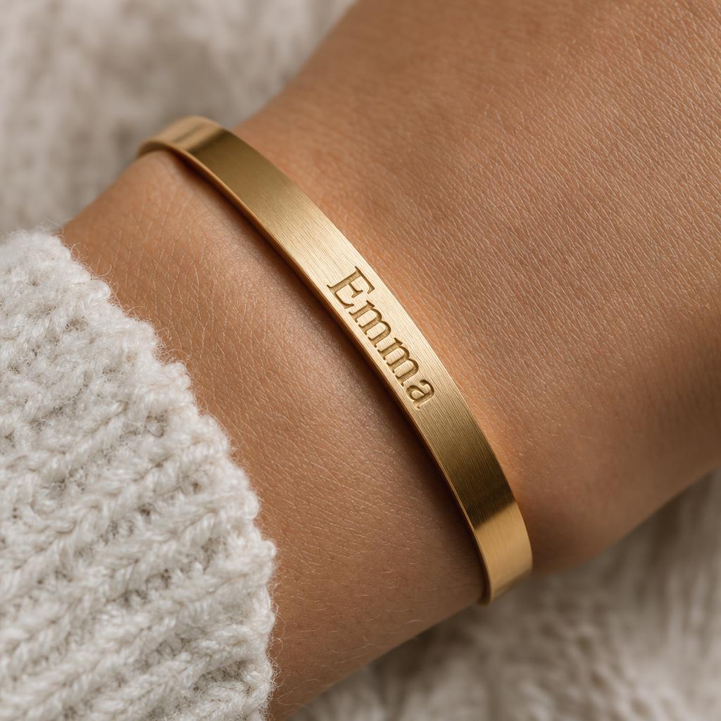Personalised gold bangle bracelet with an engraved name